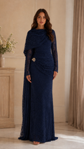 Front view of navy lace floor-length formal dress with long sleeves and cape-style overlay