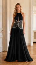 Front view of black pleated halter evening gown with embellished waist