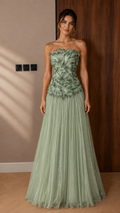 Front view of sage green strapless appliqué maxi gown with airy tulle skirt